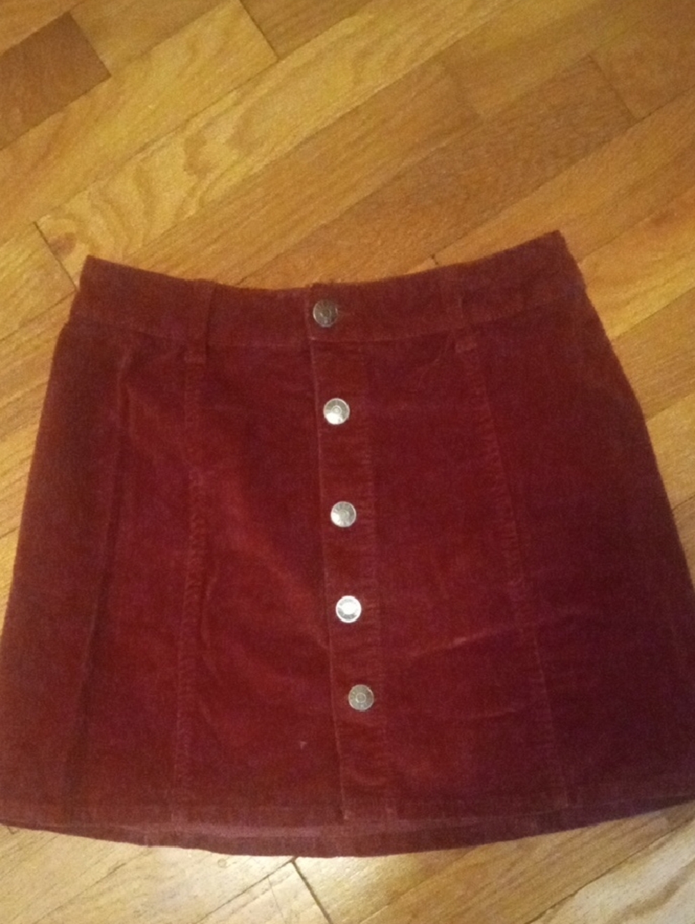 size 3 burgundy corduroy skirt, button accent down front